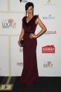 <p>Channel 10 reporter Natarsha Belling was ready for flight on the carpet in this maroon column gown complete with a feathered neck detail.</p>