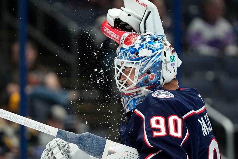 Oct 3, 2024; Columbus, Ohio, USA; Columbus Blue Jackets goaltender Elvis Merzlikins (90) sprays water on his head during the second period of the NHL hockey game against the Pittsburgh Penguins at Nationwide Arena.