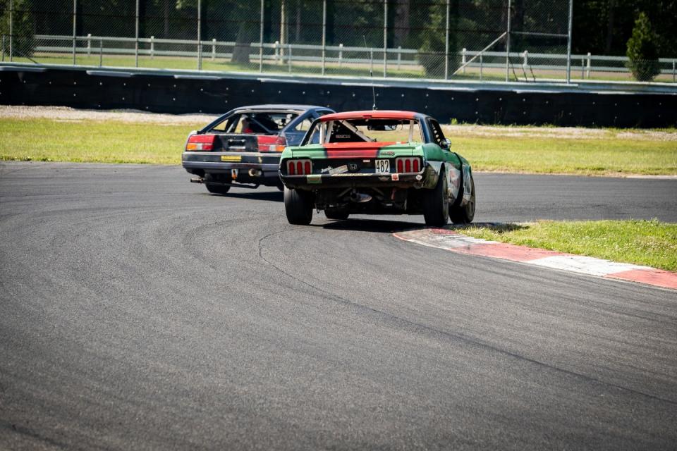 a couple of race cars on a track