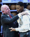 Toronto Raptors guard Kyle Lowry receives his 2019 NBA basketball championship ring from Larry Tanenbaum, chairman of Maple Leaf Sports & Entertainment, before the Raptors played the New Orleans Pelicans in Toronto on Tuesday Oct. 22, 2019. (Frank Gunn/The Canadian Press via AP)