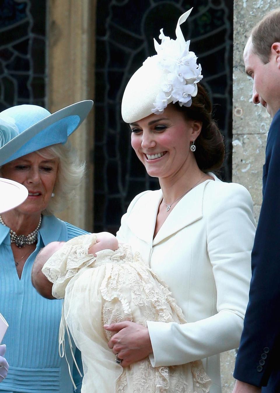 Princess Charlotte, 2015: On 5 July 2015, the Duke and Duchess of Cambridge arrived at the Church of St Mary Magdalene in Sandringham with Prince George and Princess Charlotte for the latter’s christening.The child’s godparents include Prince William and Kate Middleton’s best friends: Sophie Carter, James Meade, Adam Middleton, the Hon. Laura Fellowes, and Thomas van Straubenzee.Ahead of the baptism, Kate pushed her daughter in a vintage Millson pram that was used by Queen Elizabeth for her sons Prince Andrew and Prince Edward in the 1950s. The duchess wore a cream Alexander McQueen dress coat and a Jane Taylor hat for the occasion. (Getty Images)