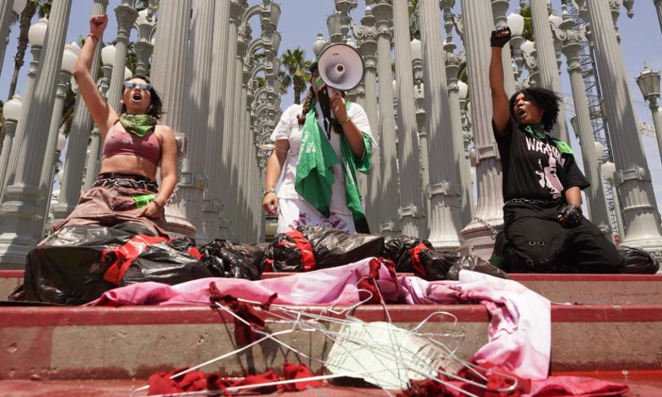 Abortion rights activists protest at the Urban Light installation outside the LA county Museum of Art.