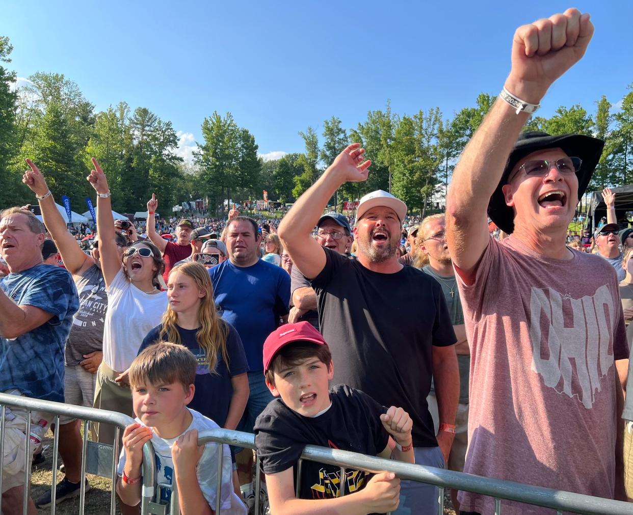 Fans enjoy the Stryper concert on Thursday afternoon on the first day of the Alive Music Festival at Atwood Lake Park in the Mineral City area. The festival continues through Saturday with headliners Jeremy Camp and Skillet.