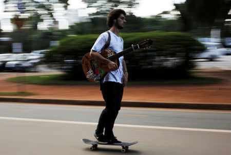 A man rolls on a skateboard at Ibirapuera Park in Sao Paulo, Brazil, April 24, 2015. Picture taken on April 24, 2015. REUTERS/Nacho Doce