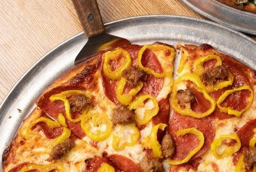 A pizza with pepperoni, sausage and banana peppers at Adriatico's Pizza [JODI MILLER]