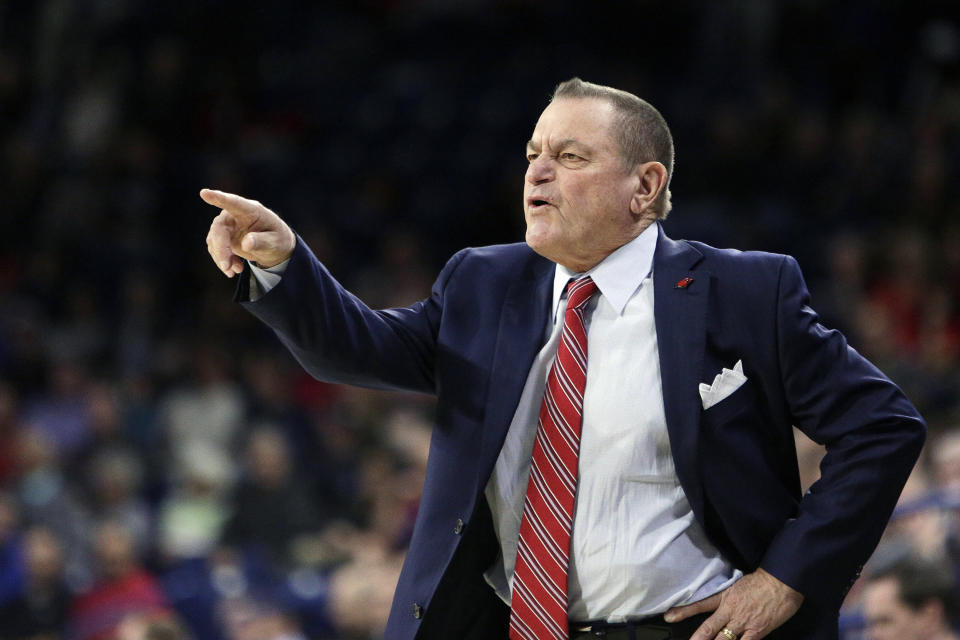 FILE - In this Nov. 29, 2017, file photo, Incarnate Word head coach Ken Burmeister directs his team during the first half of an NCAA college basketball game against Gonzaga in Spokane, Wash. Burmeister, a college basketball coach for 21 seasons who took Texas-San Antonio to the NCAA Tournament and later guided Loyola of Chicago, died Tuesday, May 19, 2020. He was 72. Loyola said Burmeister died following a bout with cancer. (AP Photo/Young Kwak, File)