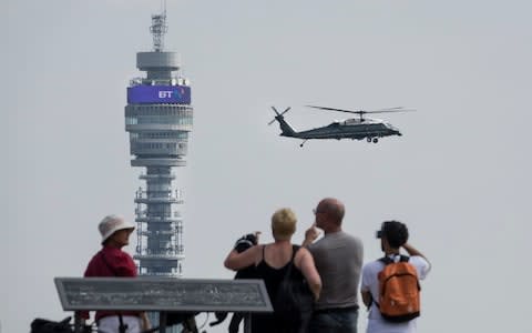 People watch from the top of Primrose Hill as President Trump comes into land on Marine One  - Credit: Peter Macdiarmid/LNP 