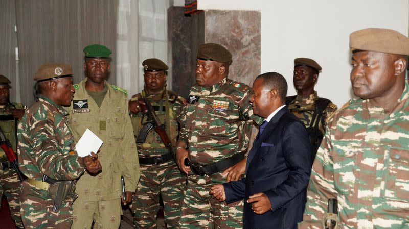 FILE PHOTO: General Abdourahmane Tiani, who was declared as the new head of state of Niger by leaders of a coup, meets with ministers in Niamey