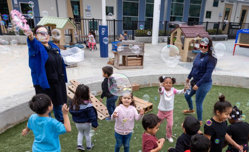 Long Beach, CA - March 20: Students play with bubbles on the playground at Educare Los Angeles at Long Beach, a very high-quality child care center in Long Beach on Wednesday, March 20, 2024 in Long Beach, CA. (Brian van der Brug / Los Angeles Times)