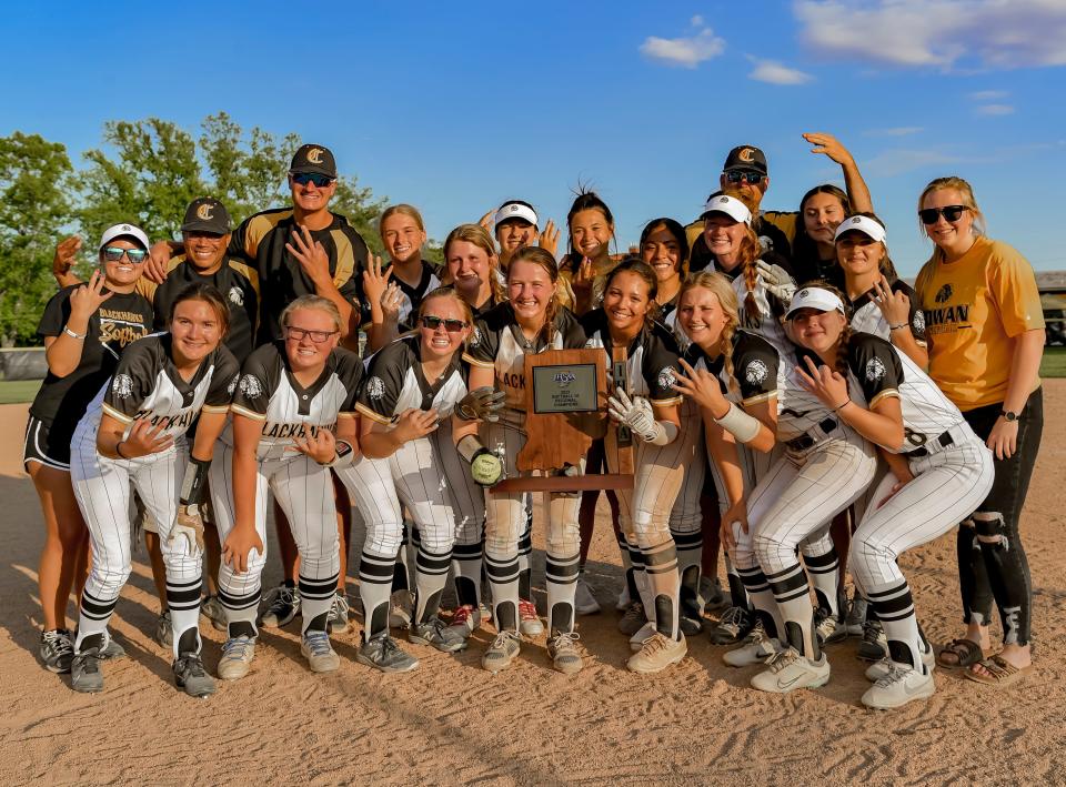 Cowan softball celebrates winning the team's regional championship game against Tri at Cowan High School on Tuesday, May 30, 2023.