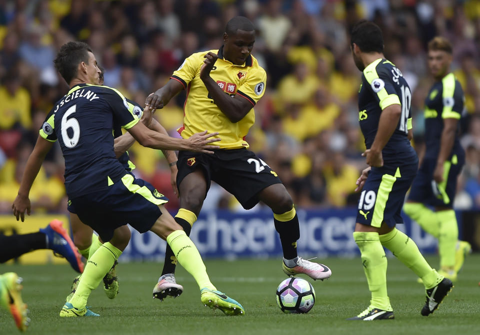 Football Soccer Britain - Watford v Arsenal - Premier League - Vicarage Road - 27/8/16 Watford's Odion Ighalo in action with Arsenal's Laurent Koscielny and Santi Cazorla Reuters / Hannah McKay Livepic EDITORIAL USE ONLY. No use with unauthorized audio, video, data, fixture lists, club/league logos or "live" services. Online in-match use limited to 45 images, no video emulation. No use in betting, games or single club/league/player publications. Please contact your account representative for further details.