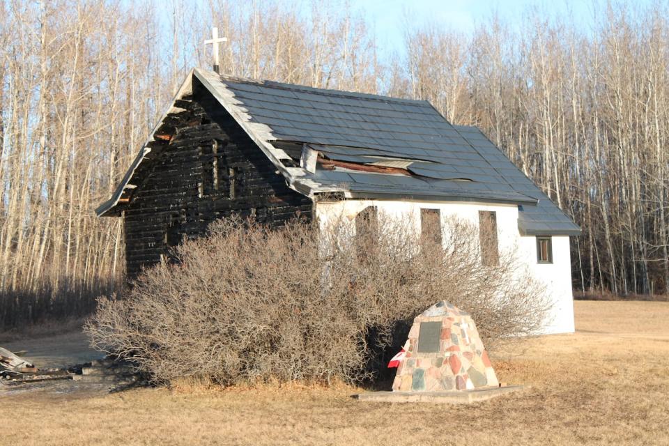 St. Aidan's lost its front entrance and a portion of the roof in an arson on Dec. 7. The building also sustained smoke and water damage, said Brenda Baron, vice-president of the community church society. (Submitted by Brenda Baron - image credit)
