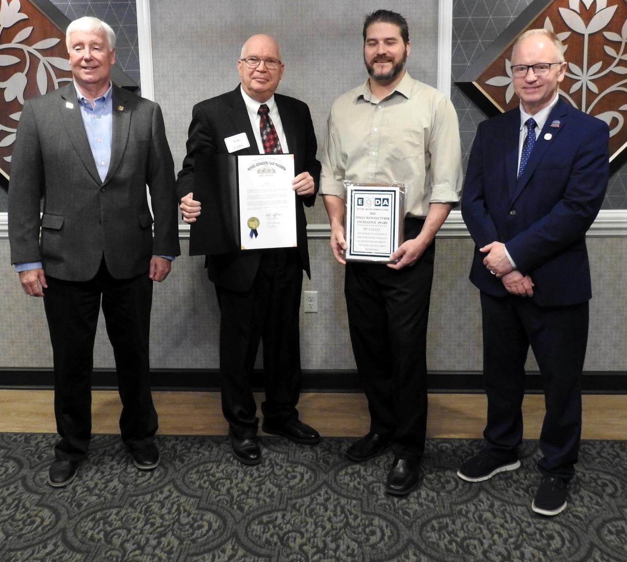 State Sen. Al Landis, Mayor Pat Cadle of Newcomerstown, Caleb Munholand of HV Coil and Tuscarawas County Commissioner Chris Abbuhl with awards presented by Landis and the Eastern Ohio Development Alliance recognizing HV Coil for its excellence as a small manufacturer in the region.