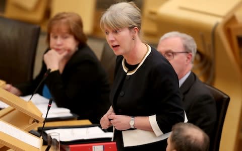 Shona Robison in the Scottish Parliament, Edinburgh, where she announced that Scotland's minimum unit price for alcohol could be in place at the start of May 2018 - Credit: PA