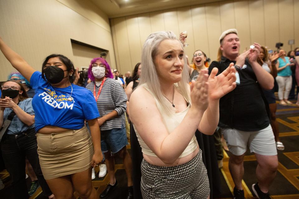 Allie Utley, middle, an Allen County resident, holds back tears while listening to election results Tuesday at a Kansans for Constitutional Freedom election watch party at the Overland Park Convention Center.