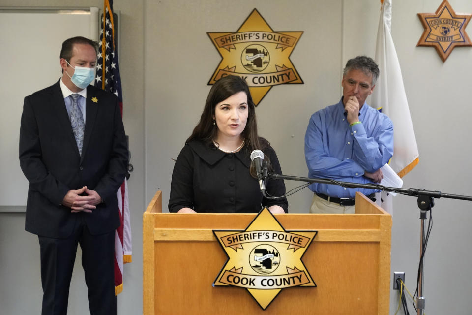 Cairenn Fullam-Binder, center, with the nonprofit organization called the DNA Doe Project, talks about the group's involvement in helping authorities identify "Gacy Victim 5" as North Carolina native Francis Wayne Alexander, during a news conference Monday, Oct. 25, 2021, in Maywood, Ill. Joining Fullam-Binder are Cook County Sheriff's Detective Lt. Jason Moran, left, and and Sheriff Tom Dart. (AP Photo/Charles Rex Arbogast)