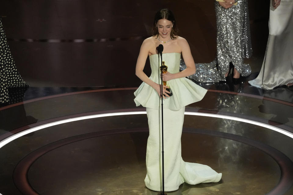 Emma Stone accepts the award for best performance by an actress in a leading role for "Poor Things" during the Oscars on Sunday, March 10, 2024, at the Dolby Theatre in Los Angeles. (AP Photo/Chris Pizzello)