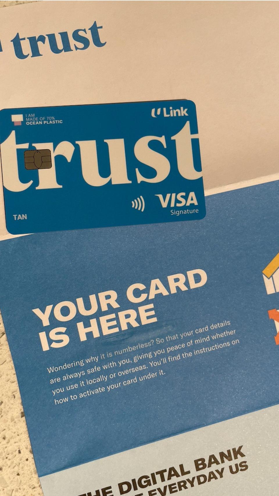 You'll receive a physical Trust credit card in the mail a week later.