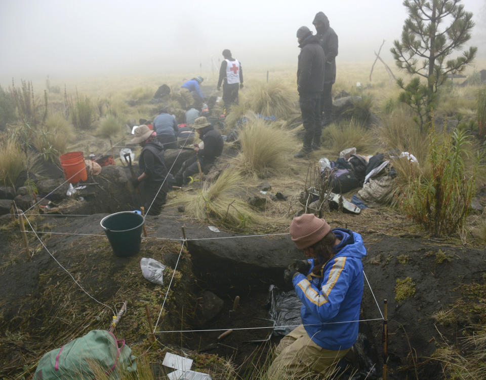 In this 2016 photo provided by Mexico’s National Institute of Anthropology and History, INAH, researchers excavate a site on the shores of Nahualac Lagoon, at the foot of the Iztaccihuatl volcano in Mexico State, Mexico. Mexican archaeologists say they have excavated a stone sanctuary in a pond on the side of a volcano east of Mexico City that may have been built as a miniature model of the universe. (Isaac Gomez/INAH via AP)
