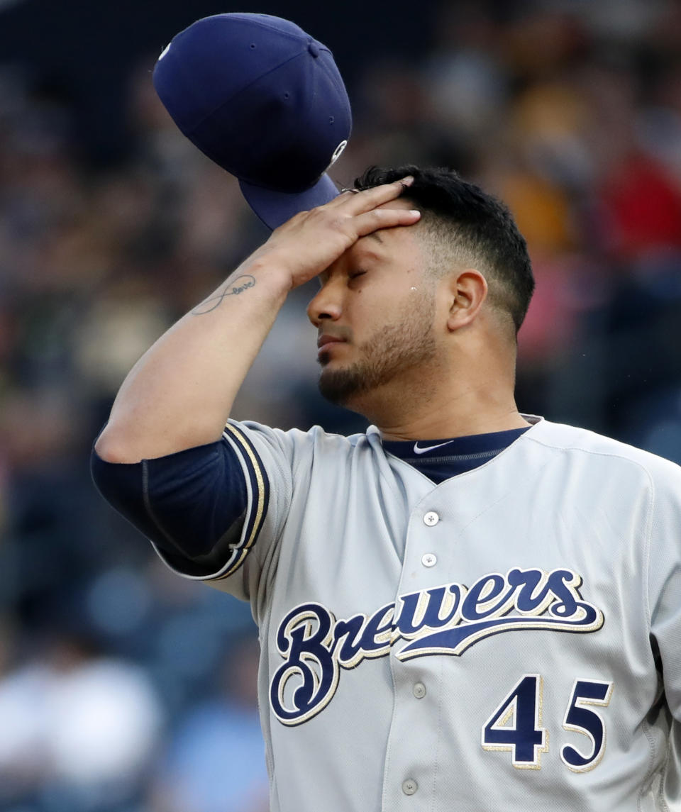 Milwaukee Brewers starting pitcher Jhoulys Chacin collects himself on the mound after giving up an RBI single to Pittsburgh Pirates' Josh Bell during the first inning of a baseball game in Pittsburgh, Friday, May 31, 2019. (AP Photo/Gene J. Puskar)