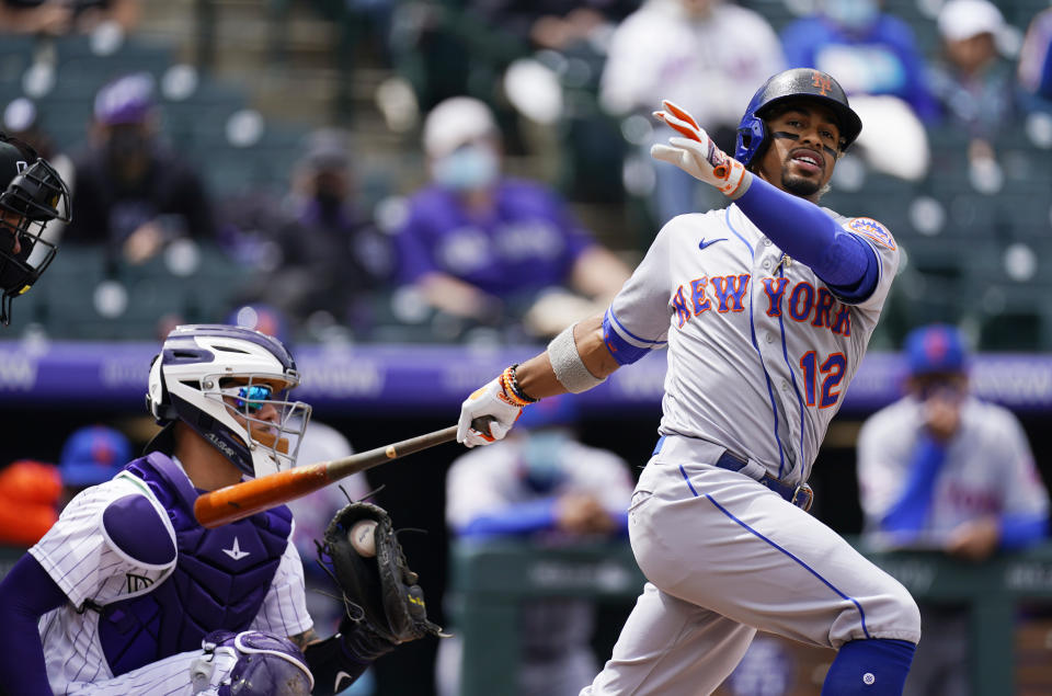 FILE - In this Sunday, April 18, 2021 file photo, New York Mets' Francisco Lindor grounds out against Colorado Rockies starting pitcher Antonio Senzatela in the first inning of a baseball game in Denver. Francisco Lindor's contract negotiations with the Mets seemed pretty smooth. His swing certainly has not. The $341 million star shortstop entered Wednesday, April 28, 2021 batting .212 with three RBIs through 18 games with his new team and started hearing boos Tuesday night at Citi Field after grounding out late in a 2-1 loss to Boston. (AP Photo/David Zalubowski, File)