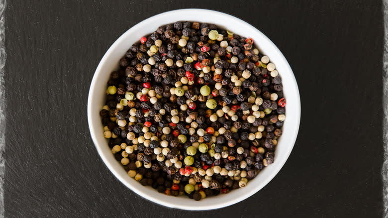 Overview of rainbow peppercorns in a bowl