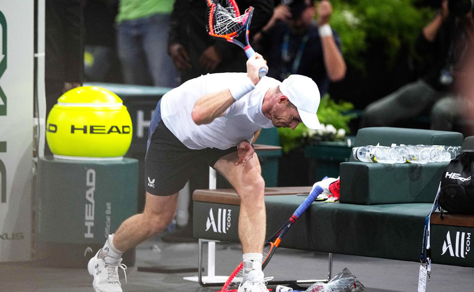 Andy Murray, pictured here smashing his racquet on numerous occasions against Alex De Minaur at the Paris Masters. 
