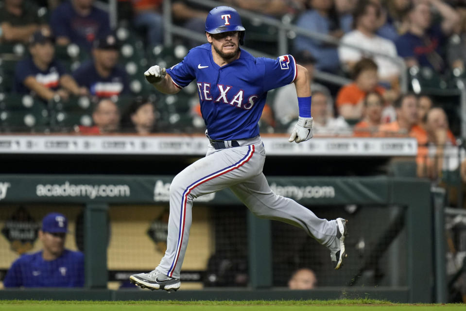 Texas Rangers' Nick Solak runs home to score on Marcus Semien's RBI single during the third inning of the team's baseball game against the Houston Astros, Wednesday, Sept. 7, 2022, in Houston. (AP Photo/Eric Christian Smith)