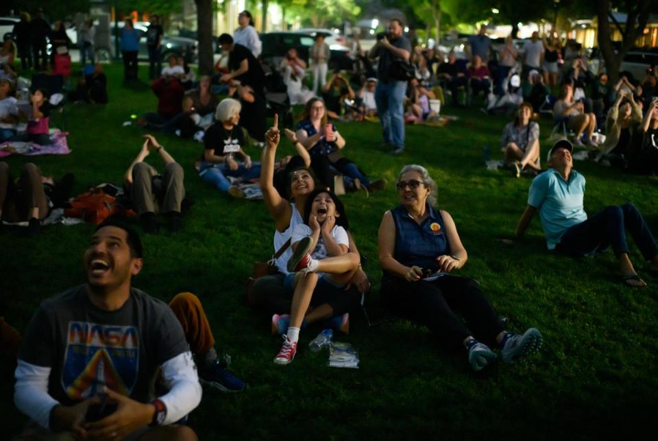 Boerne, Texas: Attendees cheer while the total eclipse pops through the clouds during the total solar eclipse on April 8, 2024 in Boerne, Texas. Mark Felix/The Texas Tribune