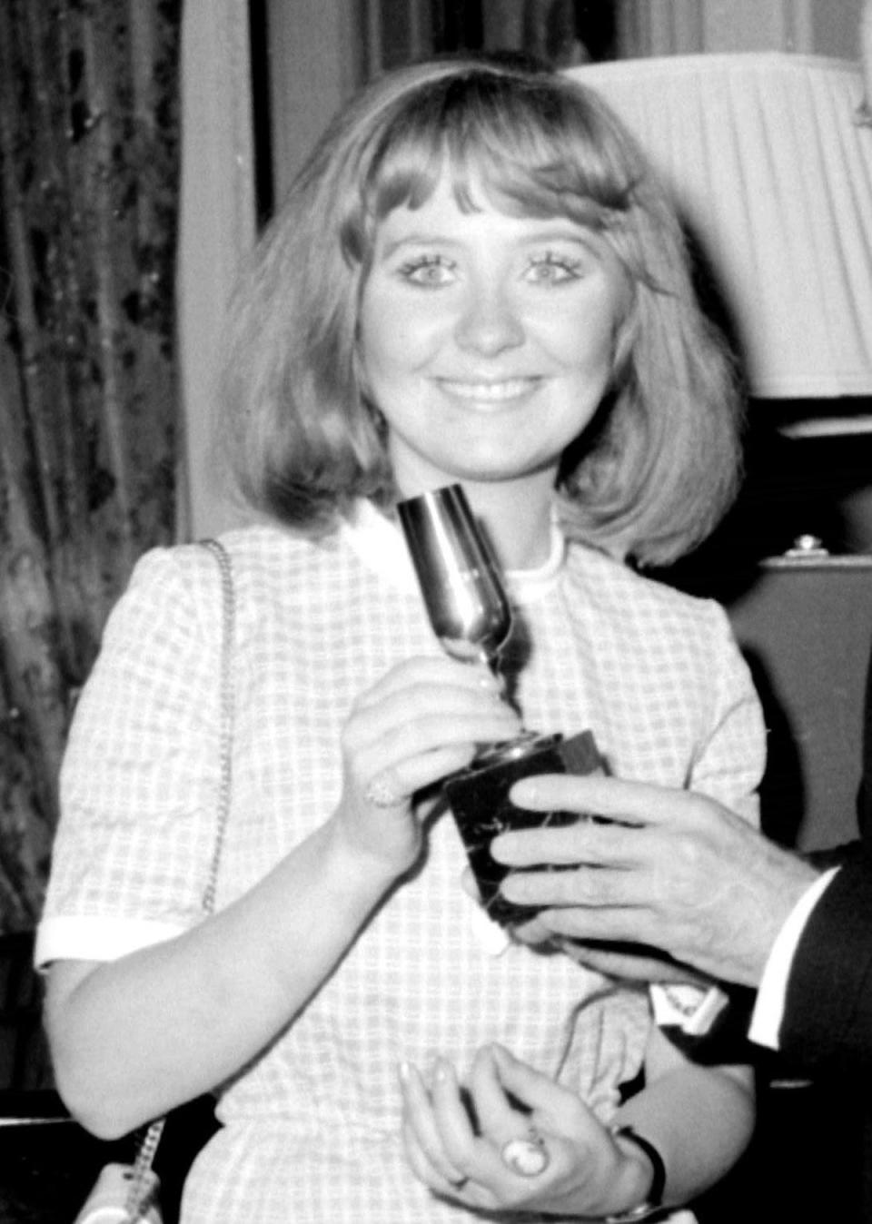 Lulu with her trophy after coming joint first in the Eurovision Song Contest (PA)