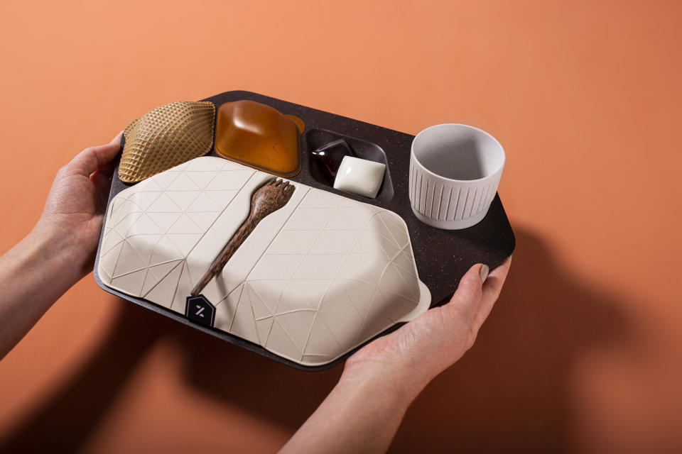 The economy meal tray designed by PriestmanGoode is made from materials including coffee grounds and husks, wheat bran, banana leaf and coconut wood.  (Photo: PriestmanGoode.)