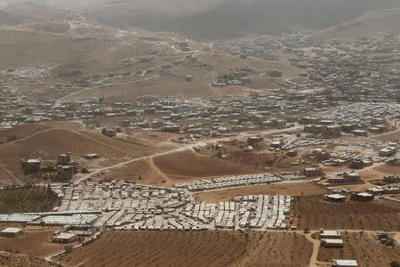 FILE PHOTO: A general view shows Syrian refugee camps dotted in and around the Lebanese town of Arsal, near the border with Syria, Lebanon September 21, 2016. Picture taken September 21, 2016. REUTERS/Mohamed Azakir/File photo