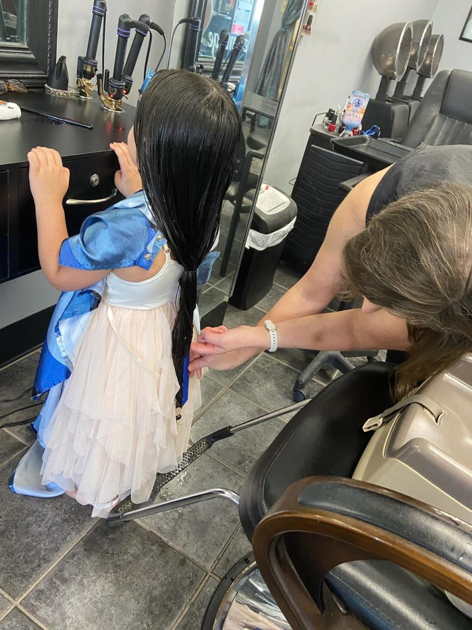 Ayla Robles, 5, is following in her family's 24-year-old tradition of donating hair to the Locks of Love Foundation, on Aug. 11, 2023.