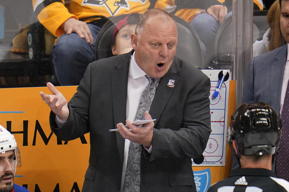New York Rangers head coach Gerard Gallant talks with referee TJ Luxmore, lower right, during the third period in Game 6 of an NHL hockey Stanley Cup first-round playoff series against the Pittsburgh Penguins in Pittsburgh, Friday, May 13, 2022. (AP Photo/Gene J. Puskar)