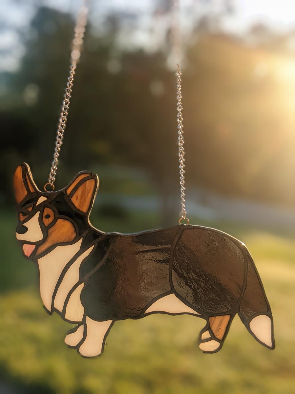 Animal portraits in glass are among the items by Jenny Blaze, one of the featured artists in this year’s Artisans in the Garden event at Tallahassee Nurseries on Nov. 4, 2023, featuring 50 local artists, musicians, and foodies.