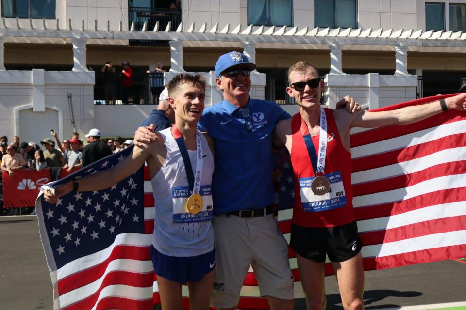 BYU track coach Ed Eyestone, center, is flanked by Conner Mantz, left, and Clayton Young. The two former BYU runners finished 1-2 at the U.S. Olympic Marathon Trials in Orlando and will represent the U.S. in the 2024 Summer Olympics in Paris this July. | Landon Southwick