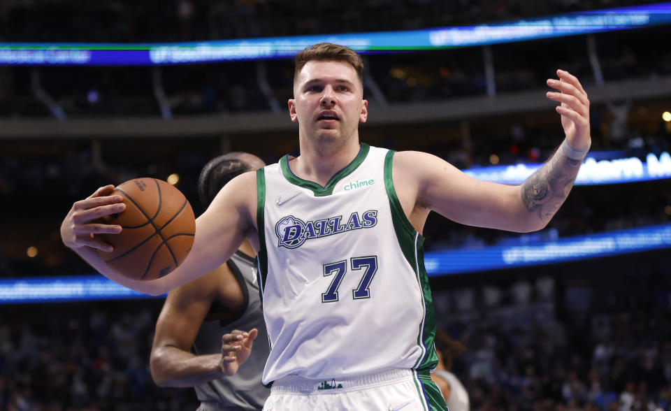 DALLAS, TX - NOVEMBER 7: Luka Doncic #77 of the Dallas Mavericks reacts after being fouled against the Brooklyn Nets in the second half at American Airlines Center on November 7, 2021 in Dallas, Texas. The Nets won 102-99. NOTE TO USER: User expressly acknowledges and agrees that, by downloading and or using this photograph, User is consenting to the terms and conditions of the Getty Images License Agreement. (Photo by Ron Jenkins/Getty Images)