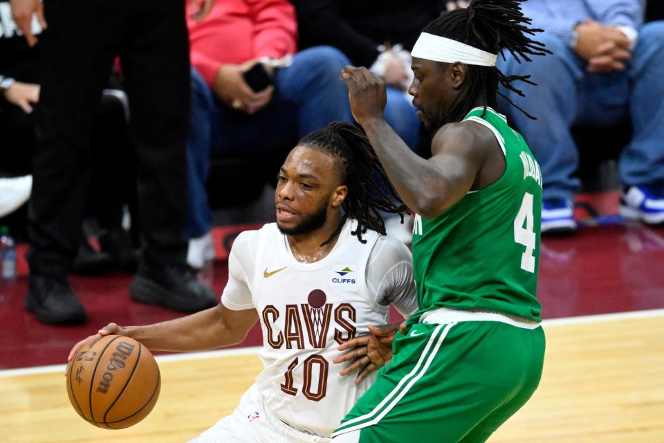 Cavaliers guard Darius Garland dribbles against Celtics guard Jrue Holiday in the third quarter of Game 3 of the Eastern Conference semifinals, May 11, 2024, in Cleveland.