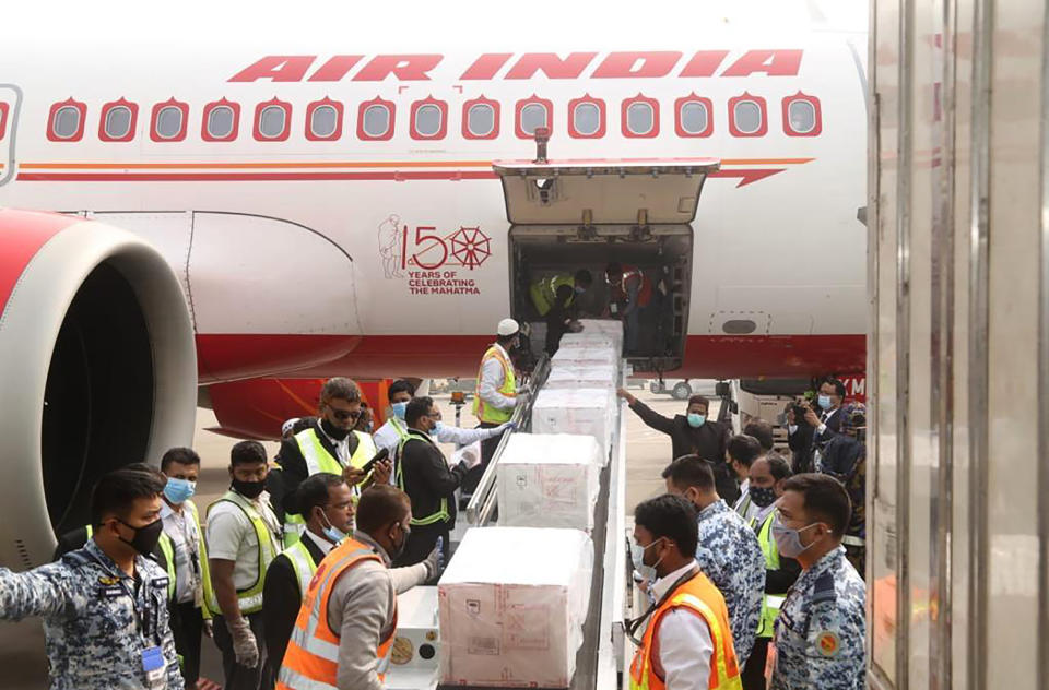 This Jan. 21, 2021, photograph provided by the High Commission of India, Dhaka, shows boxes of COVID-19 vaccines arriving in Dhaka, Bangladesh. Countries including Serbia, Bangladesh and Mexico recently began vaccinating citizens through donations or commercial deals — an approach that could leave even fewer vaccines for the program known as COVAX, since rich countries have already snapped up the majority of this year's supply. (High Commission of India in Bangladesh via AP)