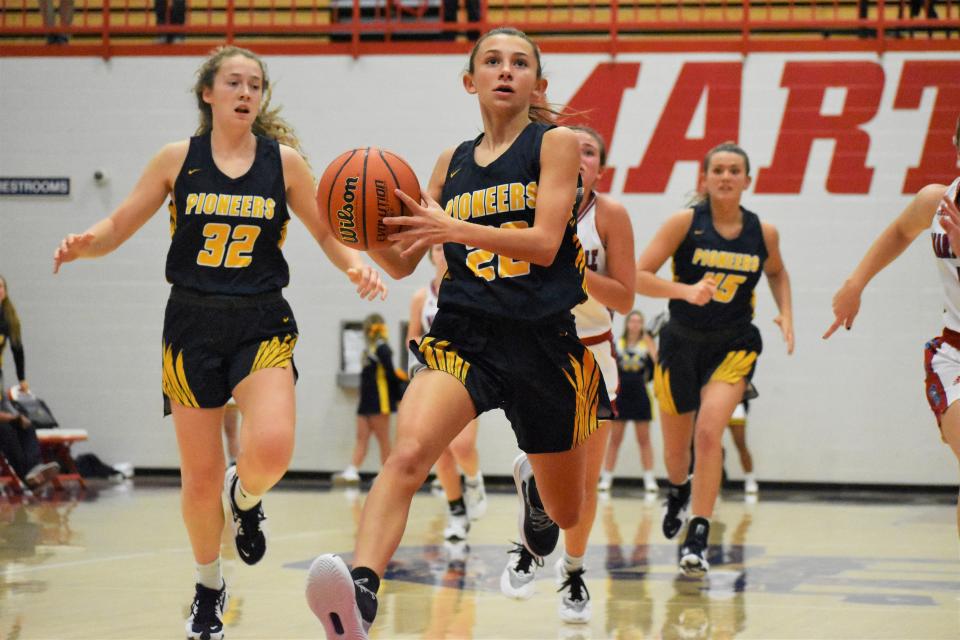 Mooresville's Lyla Jacobs gathers for a layup attempt during the rivarly matchup between the Pioneers and Martinsville on Nov. 22, 2022.