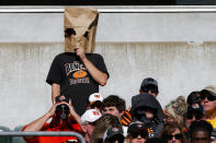 A fan reacts in the second half of an NFL football game between the Cincinnati Bengals and the Jacksonville Jaguars, Sunday, Oct. 20, 2019, in Cincinnati. (AP Photo/Gary Landers)