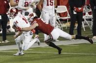 Wisconsin safety Scott Nelson tries to stop Indiana's Jack Tuttle during the second half of an NCAA college football game Saturday, Dec. 5, 2020, in Madison, Wis. Indiana won 14-6. (AP Photo/Morry Gash)