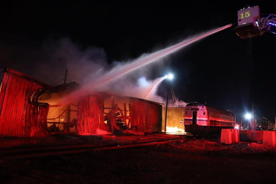 Crews extinguish the flames set to two Amtrak storage facility buildings in Beech Grove in May.