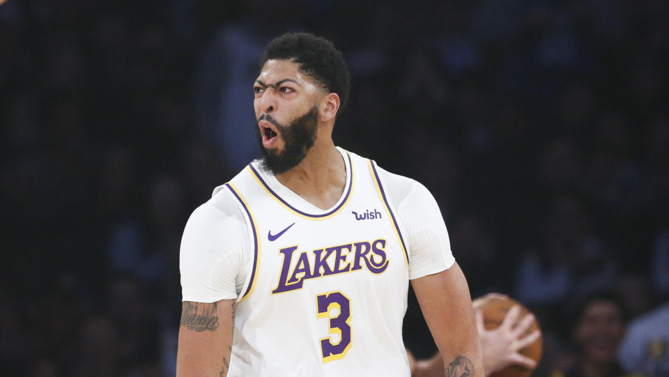 Los Angeles Lakers' Anthony Davis (3) reacts during the first half of an NBA basketball game against the Phoenix Suns , Wednesday, Jan. 1, 2020, in Los Angeles. (AP Photo/Ringo H.W. Chiu)