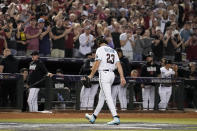 Arizona Diamondbacks starting pitcher Zac Gallen leaves the game against the Texas Rangers during the seventh inning in Game 5 of the baseball World Series Wednesday, Nov. 1, 2023, in Phoenix. (AP Photo/Brynn Anderson)