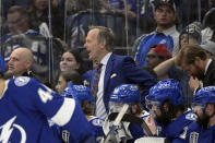 Tampa Bay Lightning head coach Jon Cooper is seen behind the bench during the second period of Game 6 of the NHL hockey Stanley Cup Finals against the Colorado Avalanche on Sunday, June 26, 2022, in Tampa, Fla. (AP Photo/Phelan Ebenhack)