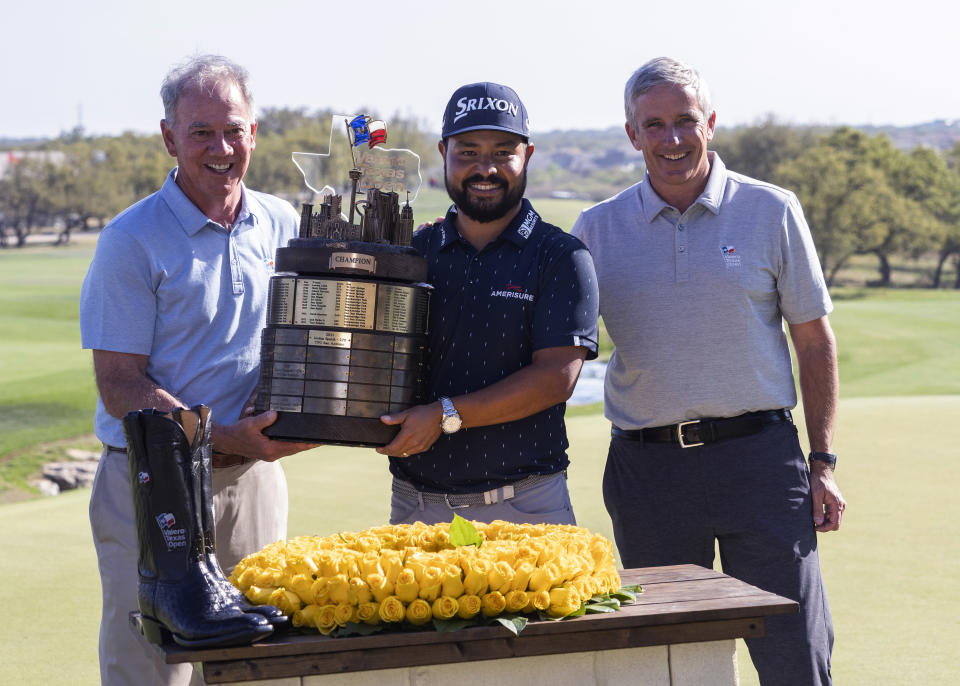 FILE - J.J. Spaun, center, is presented with the Valero Texas Open trophy by PGA Tour Commissioner Jay Monahan, right, and Valero CEO Joe Gorder after the final round of the golf tournament in San Antonio, Sunday, April 3, 2022. Gorder has been appointed to the PGA Tour board of directors. (AP Photo/Michael Thomas, File)