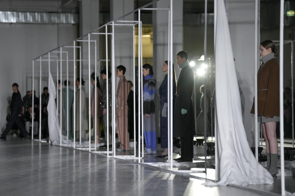 Models wear creations as part of the men's Federico Cina Fall-Winter 2024-2025 collection, that was presented in Milan, Italy, Saturday, Jan. 13, 2024. (AP Photo/Antonio Calanni).