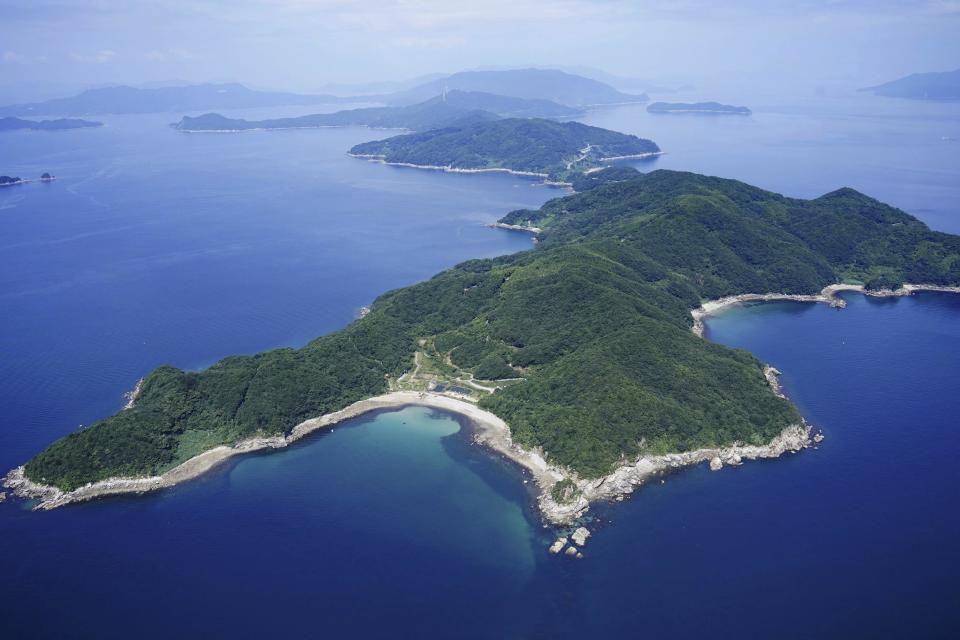 This photo taken on Aug. 2, 2023, shows the Nagashima island of Kaminoseki town, southwestern Japan. A Japanese town says it has agreed to a geological study to determine its suitability as an interim storage site for spent nuclear fuel. Kaminoseki, a small town in the southwestern prefecture of Yamaguchi, says it will accept the offer of a survey by Chugoku Electric Power Co., one of two major utility operators, along with Kansai Electric Power Co., whose spent fuel storage pools are almost full. (Kyodo News via AP)