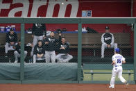 Kansas City Royals left fielder Andrew Benintendi watches as a two-run home run hit by Chicago White Sox's Danny Mendick falls into the White Sox bullpen during the first inning of a baseball game Saturday, May 8, 2021, in Kansas City, Mo. (AP Photo/Charlie Riedel)